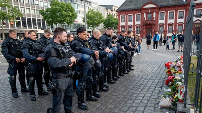 A 29-year-old police officer died after being repeatedly stabbed during an attack at an anti-Islam rally in Germany.